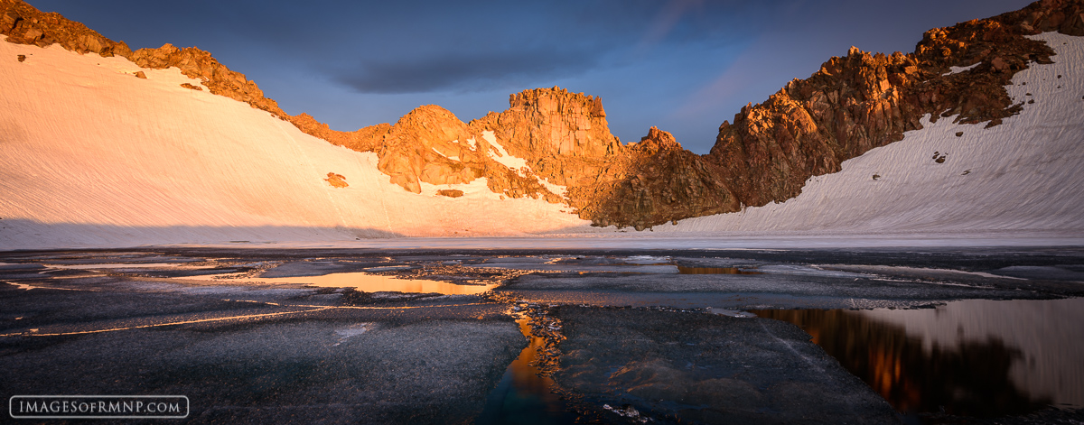 Though it is late July, this lake located at over 13,000 feet above sea level is still covered in ice and snow. However, the...