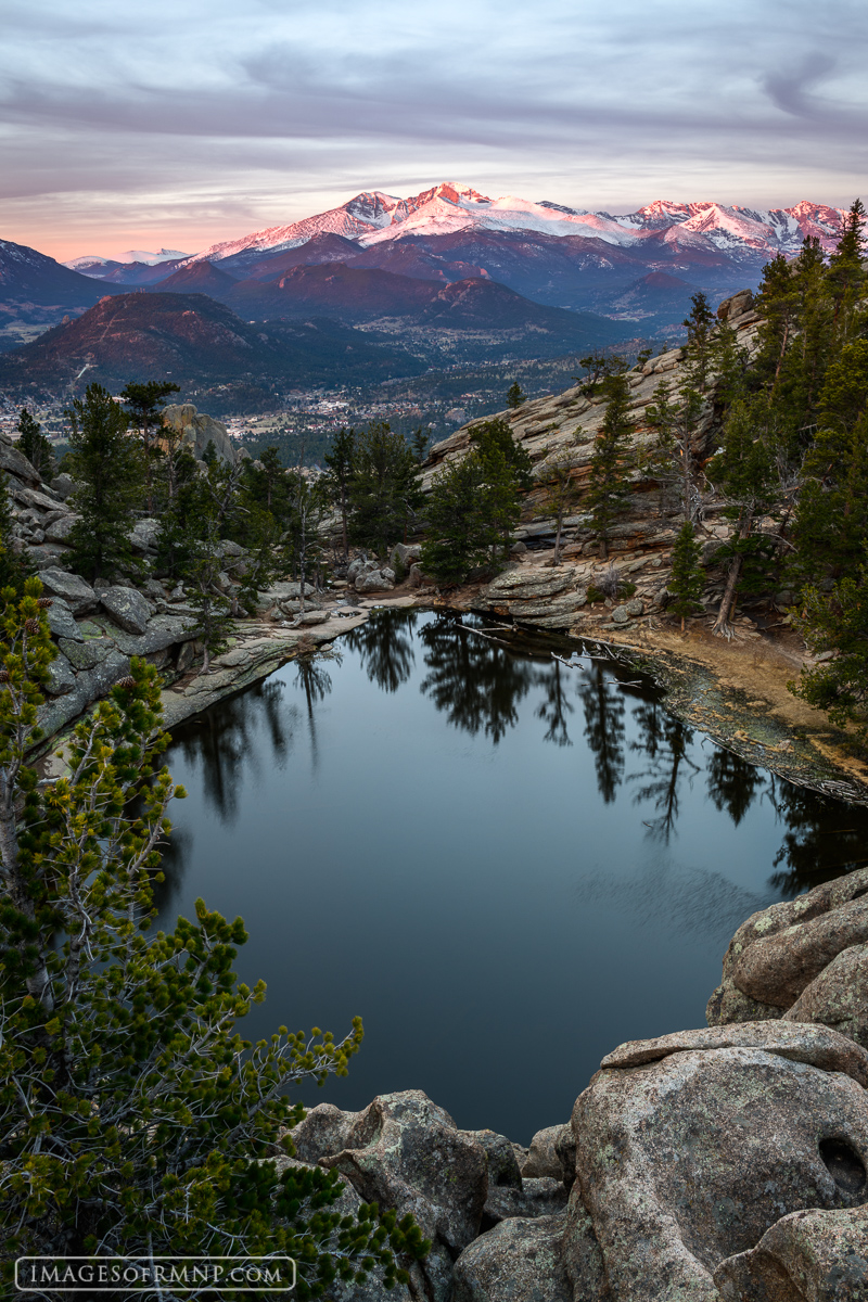 Longs Peak glows with the first light above Estes Park while Gem Lake quietly anticipates the new day.&nbsp;